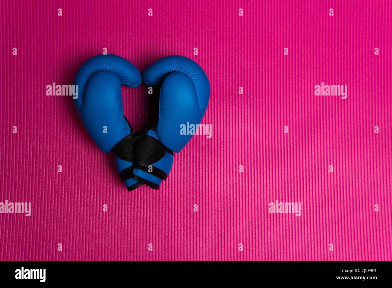 Boxing blue glove heart glovesleather mat isolated white protection