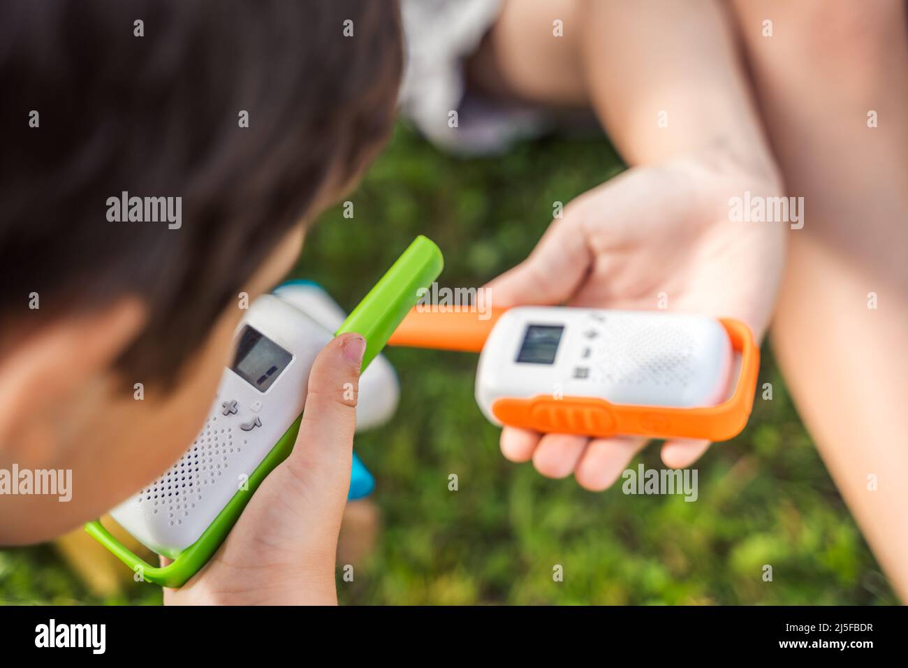Small kids,girls play in walkietalkie.Walkie Talkies with channels.Game of detectives, spies