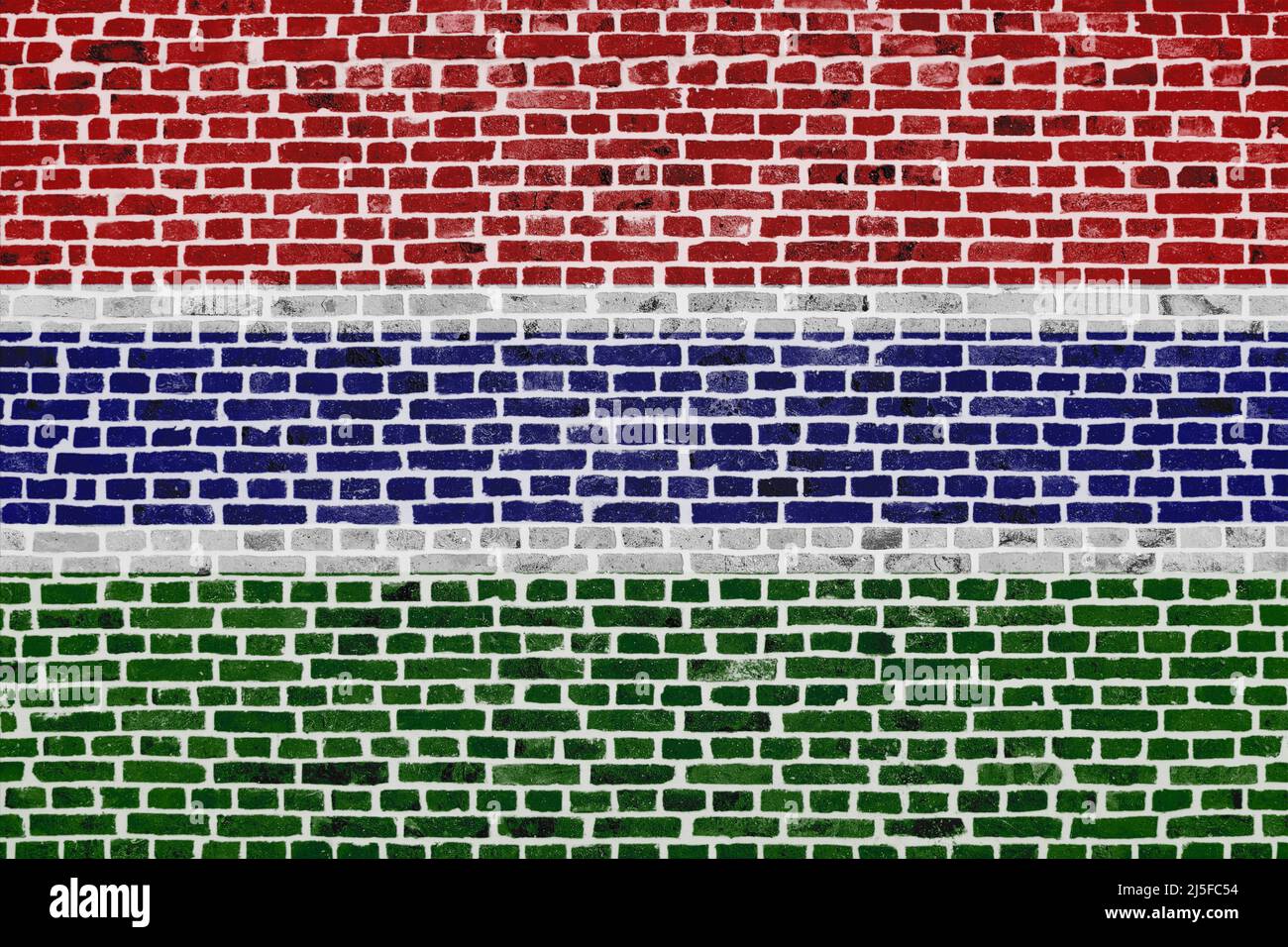 Close-up on a brick wall with the flag of Gambia painted on it Stock ...