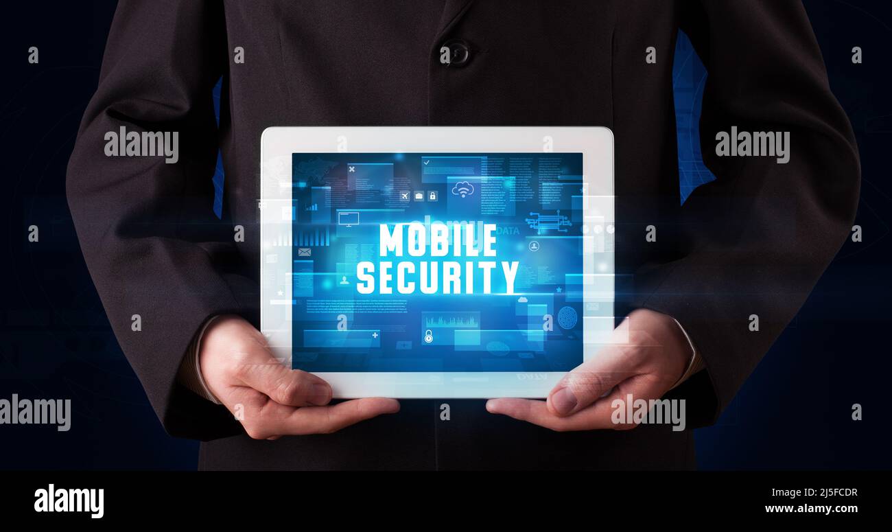 Guard Using Tablet Person holding tablet, security concept Stock Photo - Alamy
