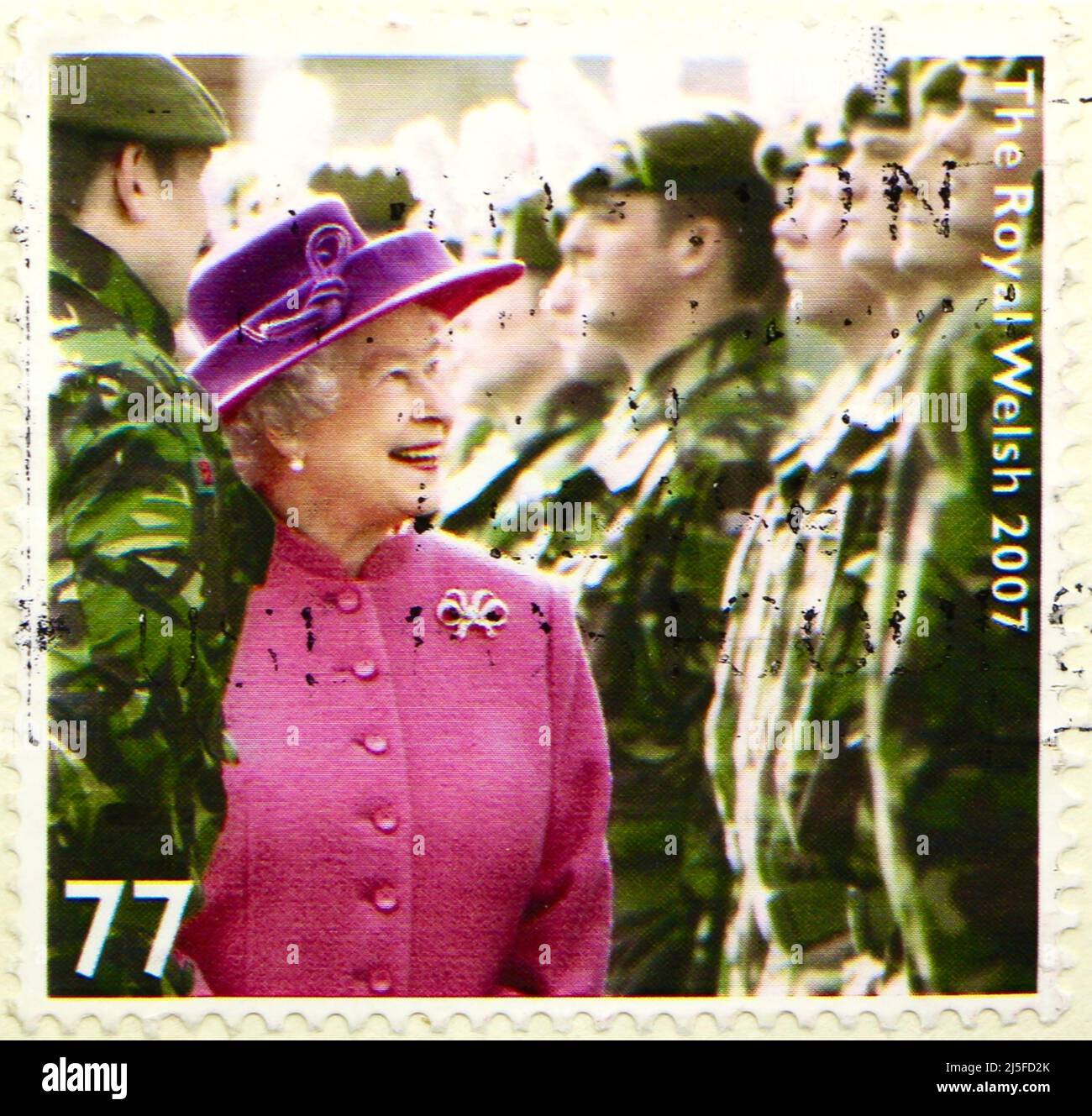 Photo of a stamp depicting Queen Elizabeth II inspecting the Royal Welsh regiment in 2007 Stock Photo