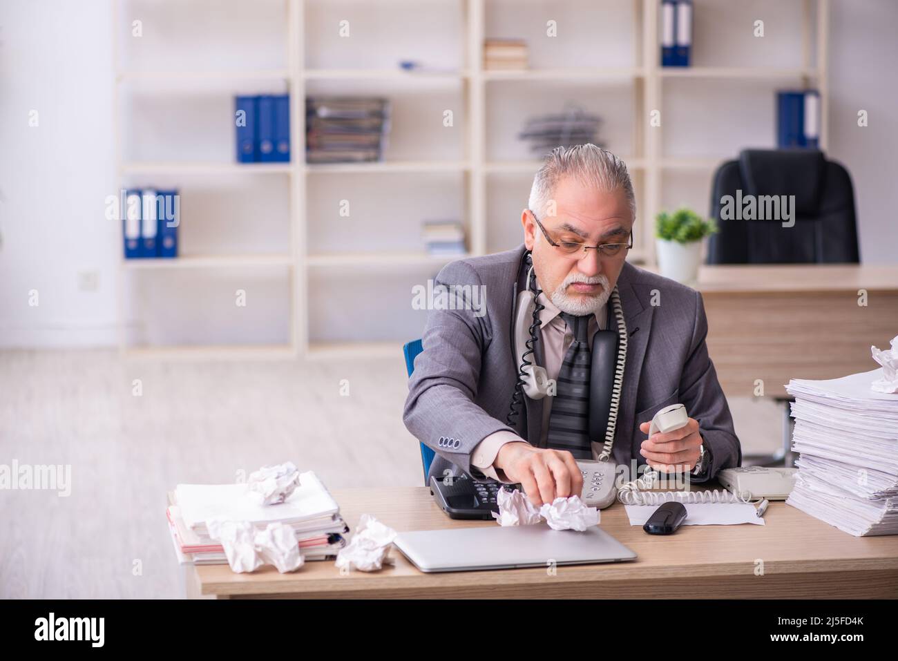 Old businessman employee working at workplace Stock Photo - Alamy