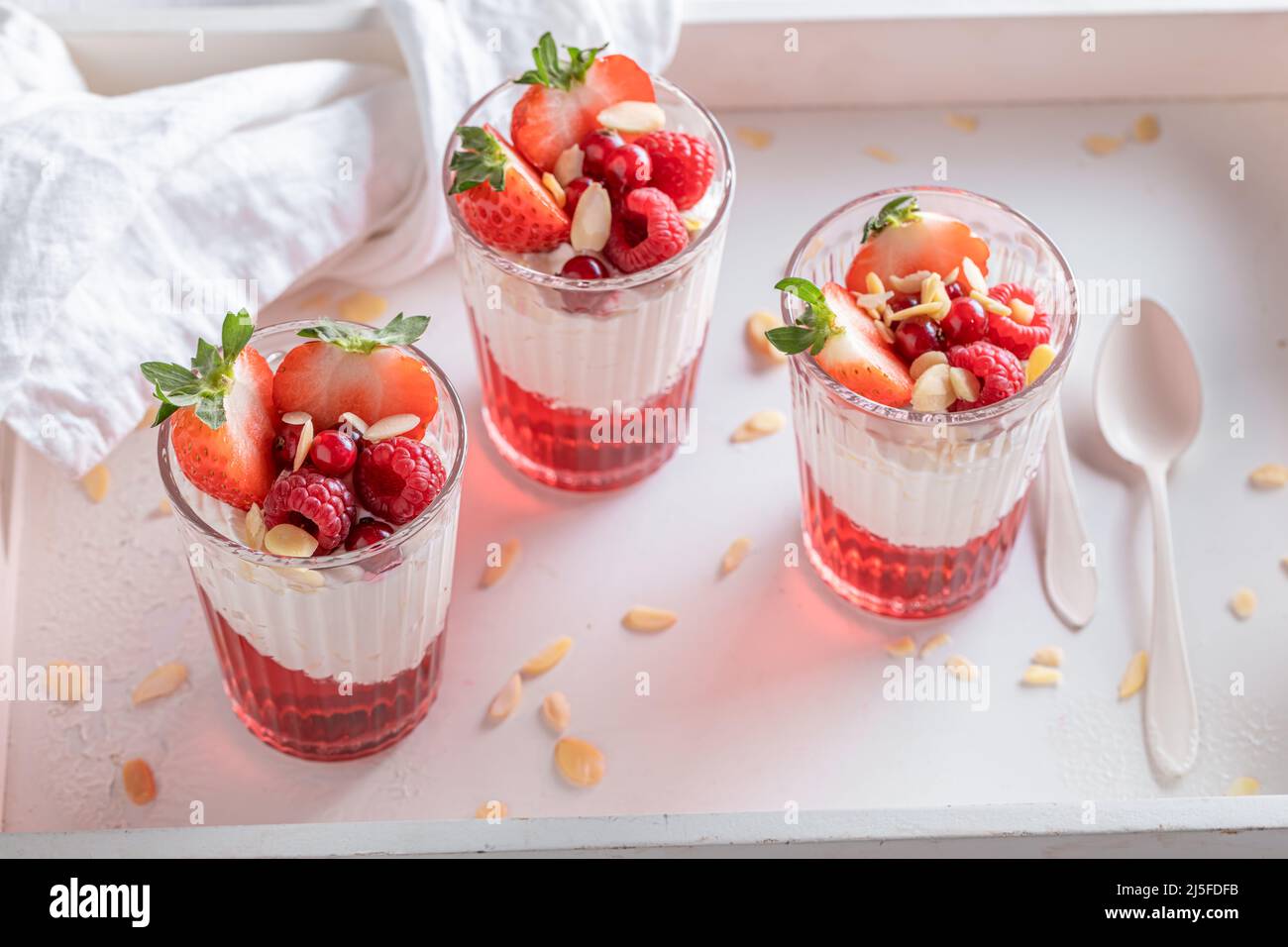 Homemade and tasty red jelly made of fruits and gelatin. Jelly with