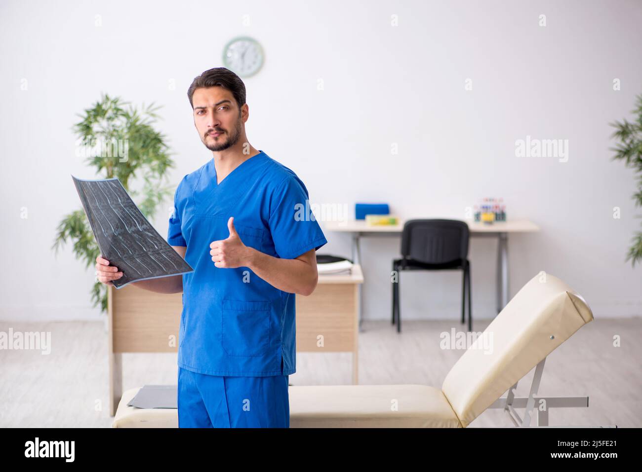Young doctor radiologist sitting in the clinic Stock Photo Alamy