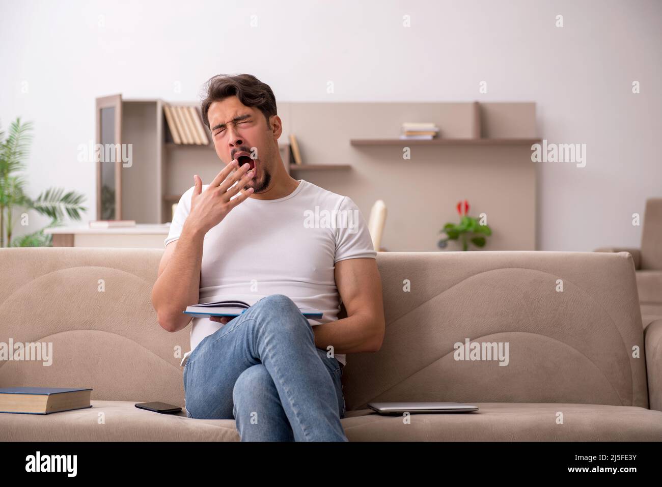 Young student studying at home during pandemic Stock Photo - Alamy