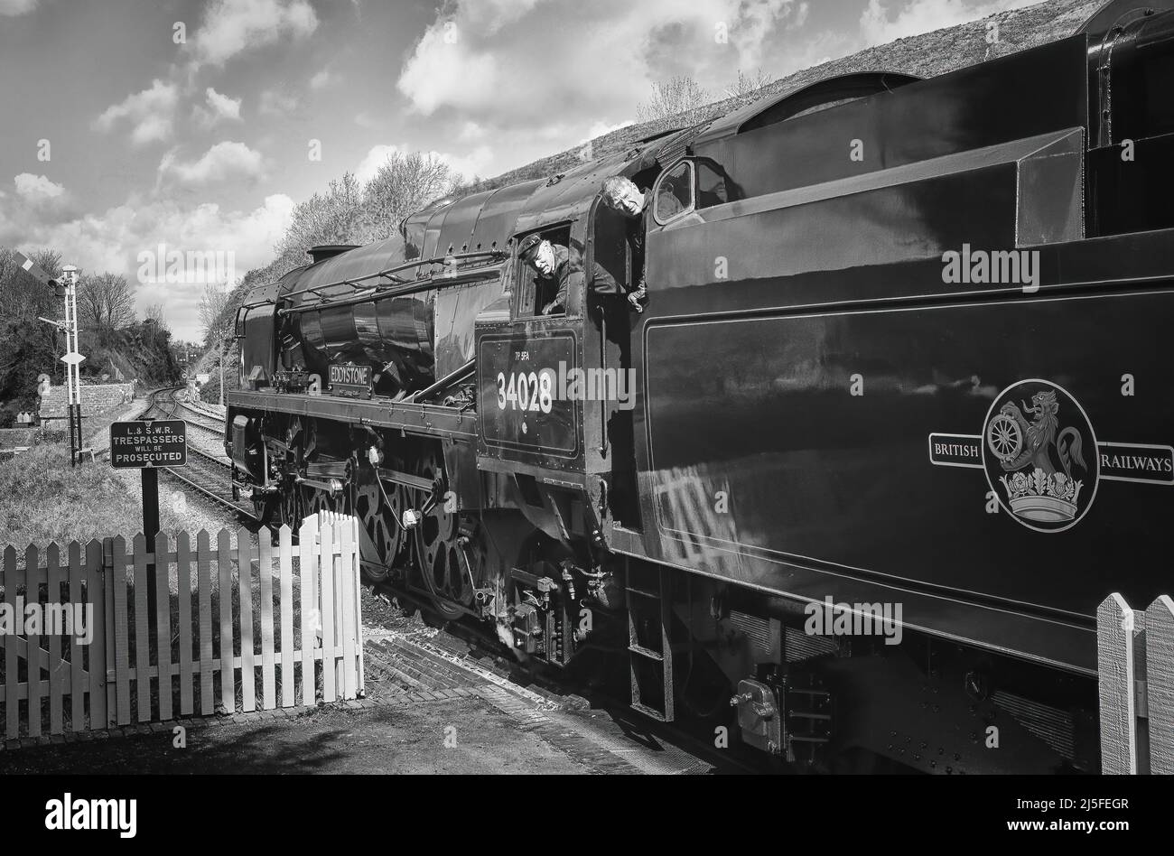 34028 Eddystone - Bulleid Light Pacific Steam Locomotive, currently operational on the Swanage Service, shown here just about to depart Corfe Castle Stock Photo