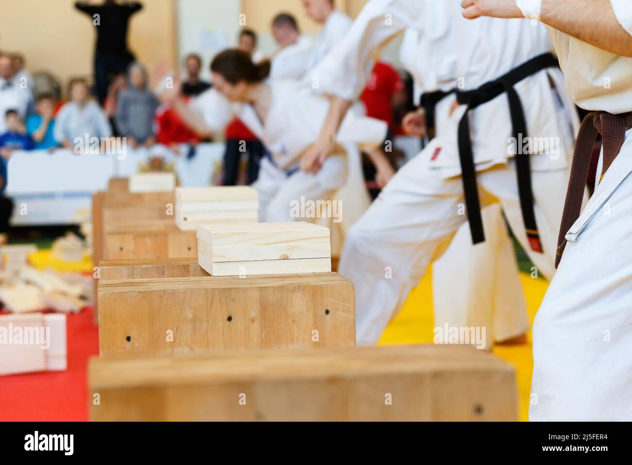 Martial artists breaks the wooden boards by hand Stock Photo