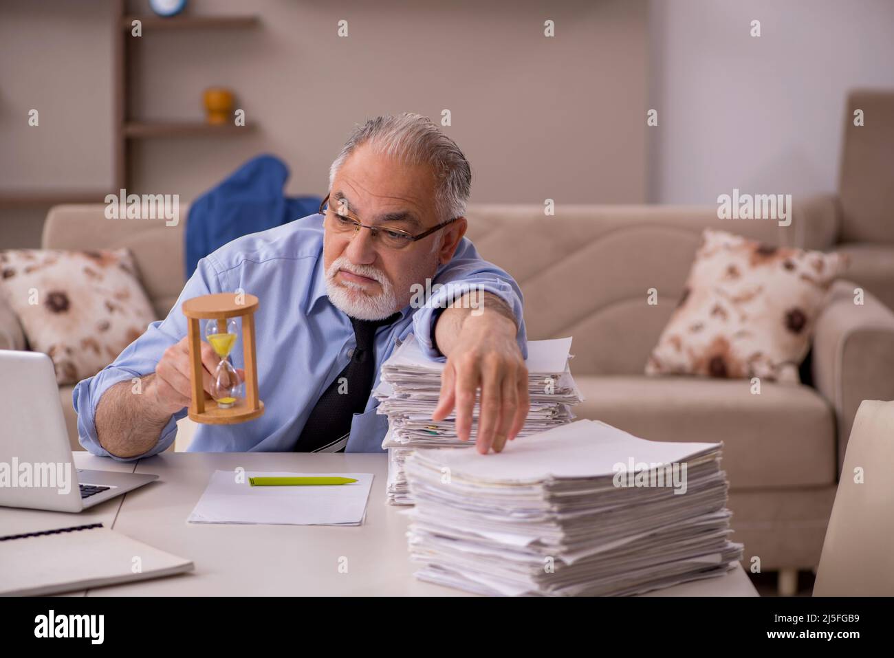 Old boss working from home during pandemic Stock Photo Alamy