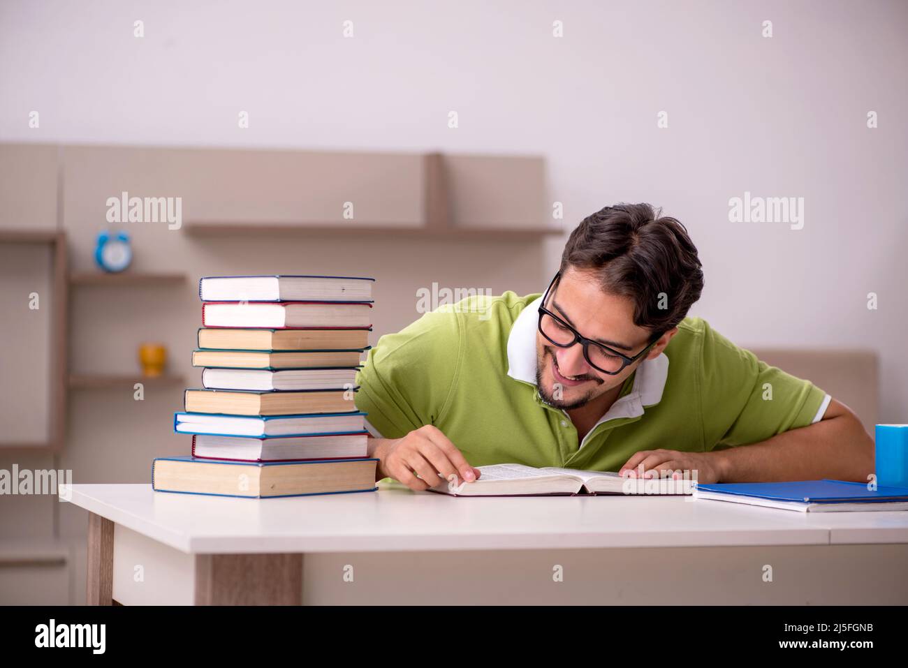 Young student studying at home Stock Photo - Alamy