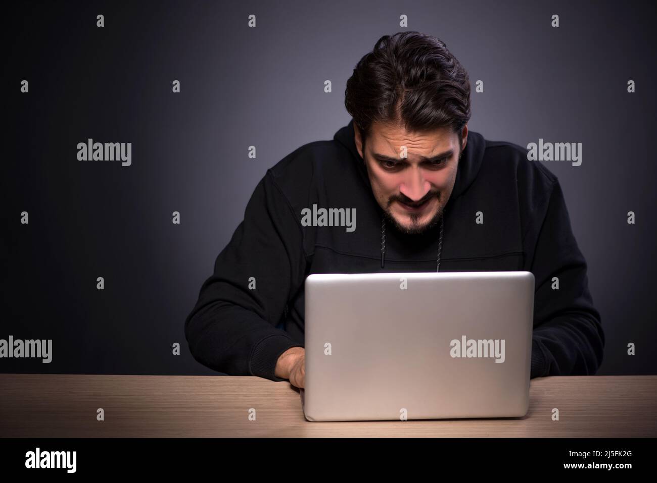 Male student hacker in hood hi-res stock photography and images - Alamy