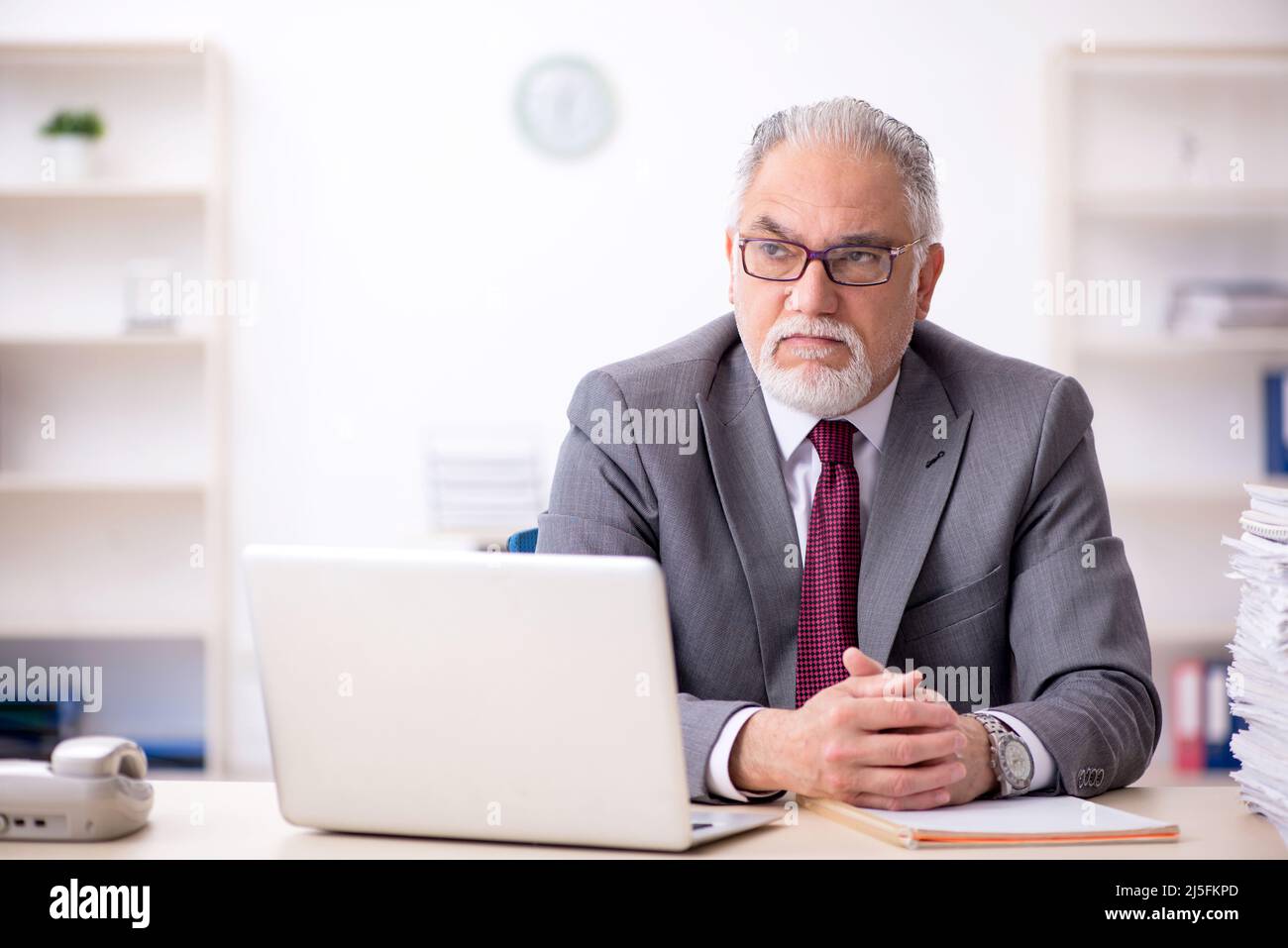 Old employee and too much work in the office Stock Photo Alamy