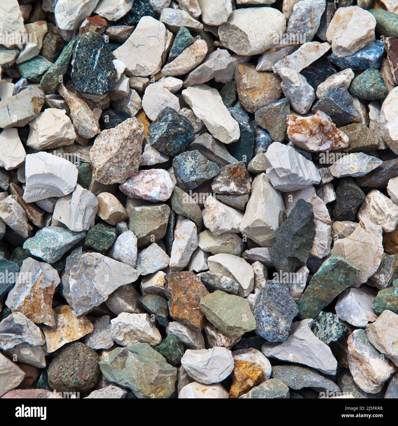 Colored pebbles texture background, decorative small stones texture wallpaper Stock Photo