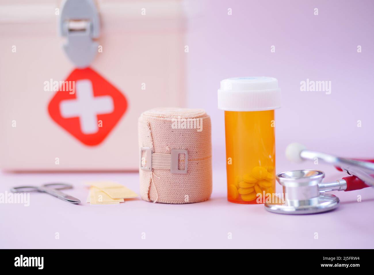 first aid kit box and medical pill on table  Stock Photo