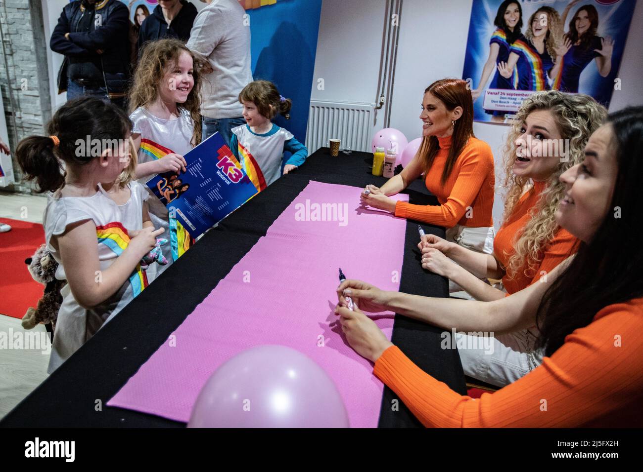2022-04-23 11:52:59 BERGEN OP ZOOM - The Belgian girl group K3 with from left to right Hanne Verbruggen, Julia Boschman and Marthe DePillecyn will sign the new album Waterval during Record Store Day. Many fans, both young and old, stood in a line of more than a hundred meters for a long time. ANP KIPPA PAUL BERGEN netherlands out - belgium out Credit: ANP/Alamy Live News Stock Photo