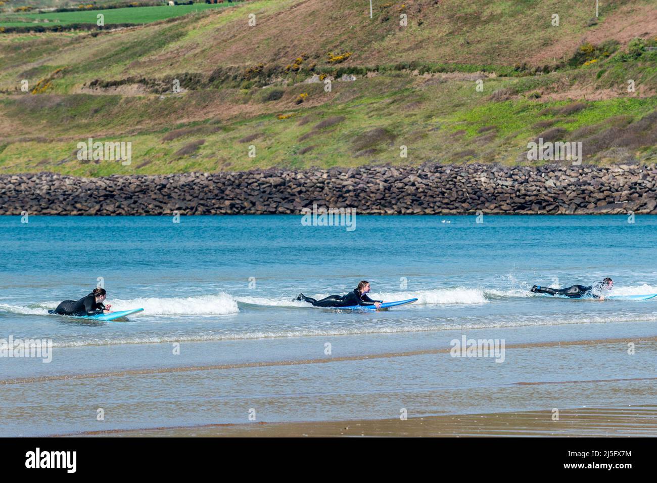 Inch Beach, County Kerry, Ireland. 23rd Apr, 2022. The sun shone on Inch Beach, County Kerry today. Despite the sunshine and warm temperatures, the beach was relatively quiet, but getting busier. Kingdom Waves Surf School's lessons were very popular. Credit: AG News/Alamy Live News Stock Photo