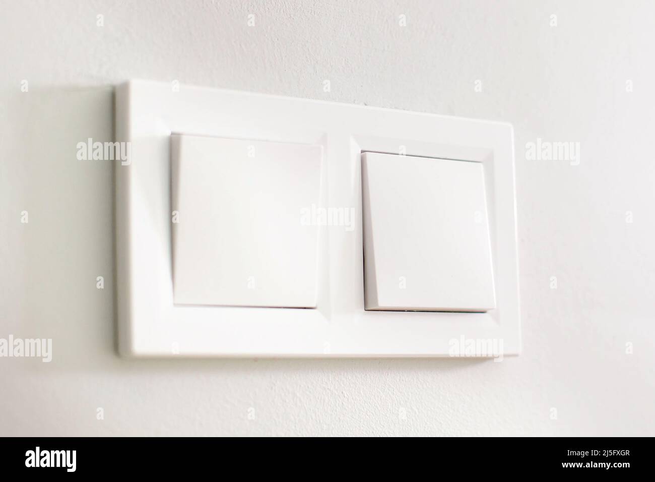 Light switches, white plastic mechanical switches mounted on white