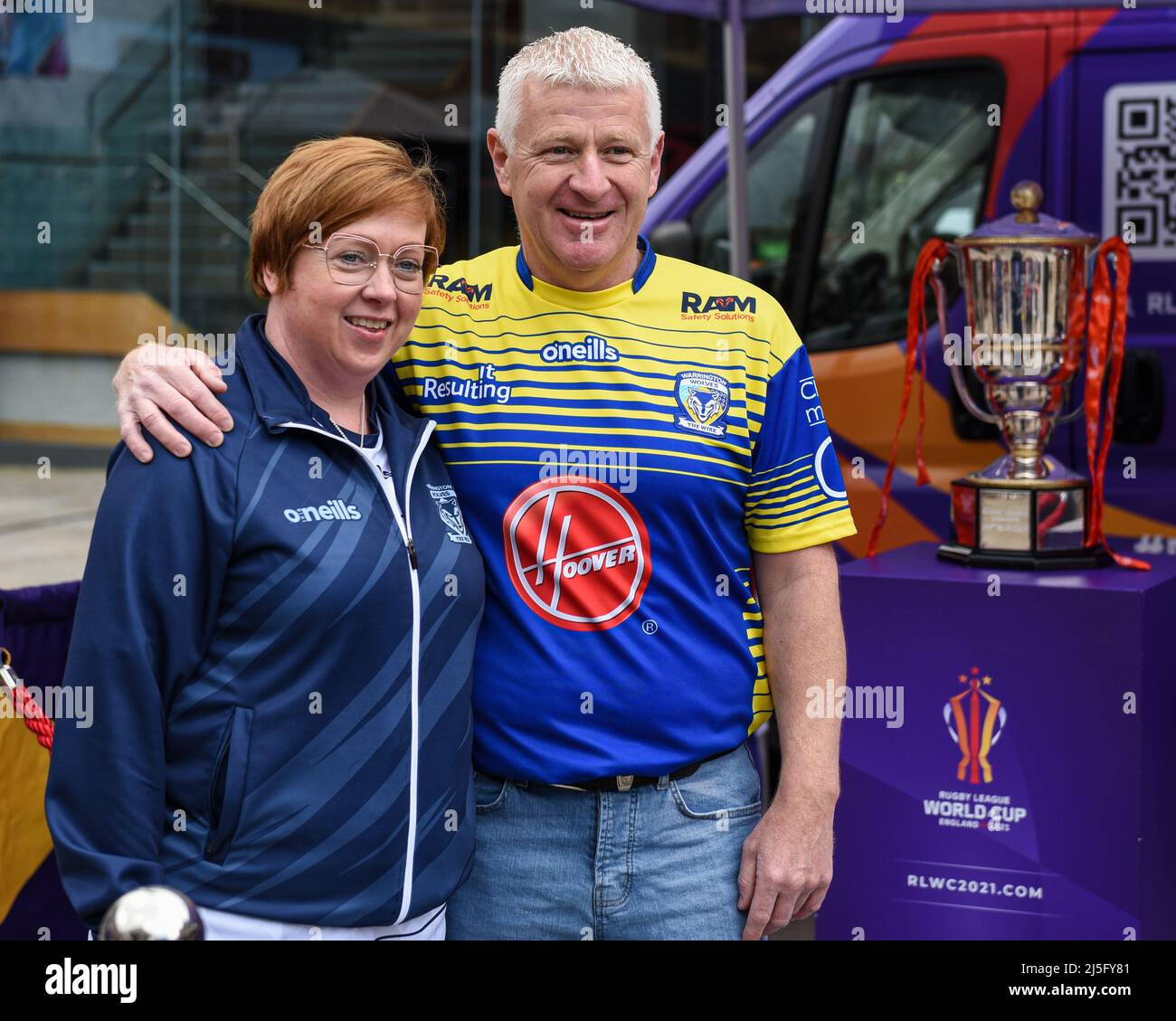 Warrington, UK. 23rd Apr, 2022. Some Warrington Wolves fans pose for photos next to the Rugby League World Cup Trophies in the fan zone before the game in Warrington, United Kingdom on 4/23/2022. (Photo by Simon Whitehead/News Images/Sipa USA) Credit: Sipa USA/Alamy Live News Stock Photo