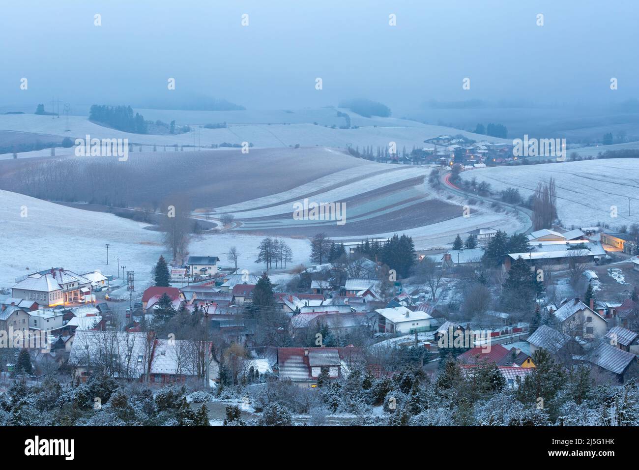 Turcianske Jaseno village and foggy winter rural landscape, Slovakia. Stock Photo