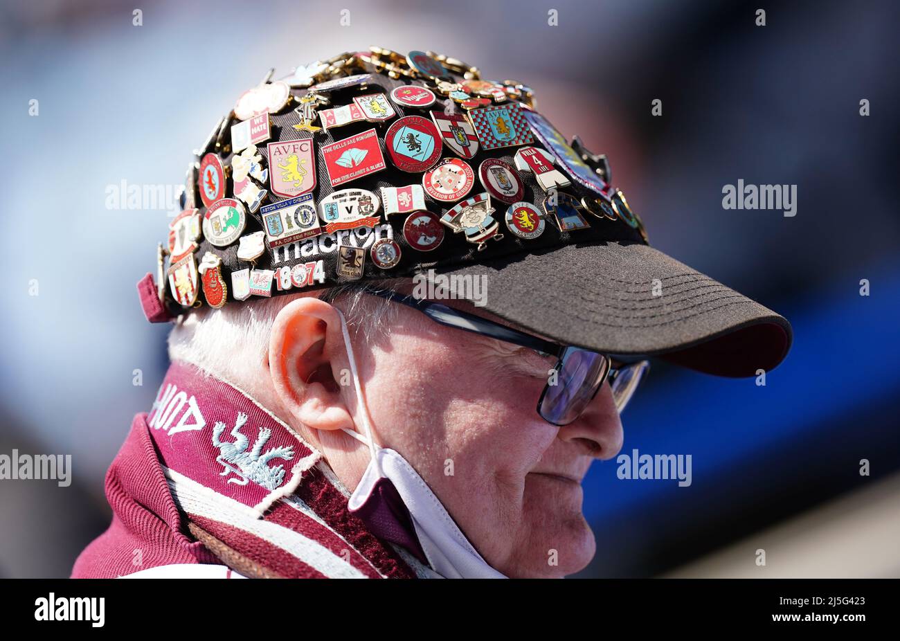 An Aston Villa fan wearing a cap fully adorned with club badges during the  Premier League match at the King Power Stadium, Leicester. Picture date:  Saturday April 23, 2022 Stock Photo - Alamy