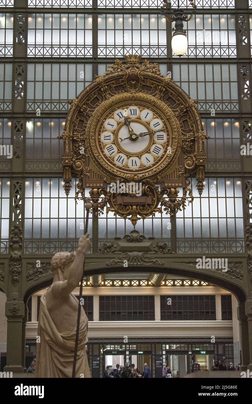 Paris: the sculpture Napoleon First Legislator by Eugene Guillaume and the clock in the Musee d'Orsay, museum in a former Beaux-Arts railway station Stock Photo