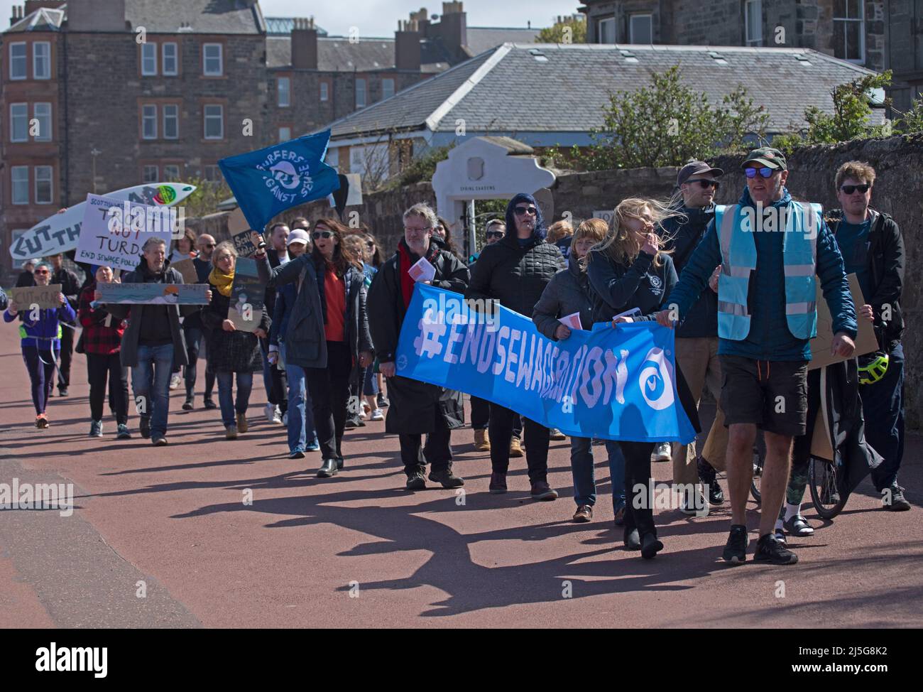 Portobello, Edinburgh, Scotland, UK. 23rd April 2022. End Sewage Pollution protest, people of all ages came together  protesting against Scottish Water to demand they end sewage pollution. Including Surfer's against sewage, anyone with a love for the ocean or the rivers was invited. The group marched peacfully from the Seafield end of the promenade up Kings Road along the Portobello High Street eventually cutting back to the east end of the promenade. Credit: Archwhite/alamy live news Stock Photo