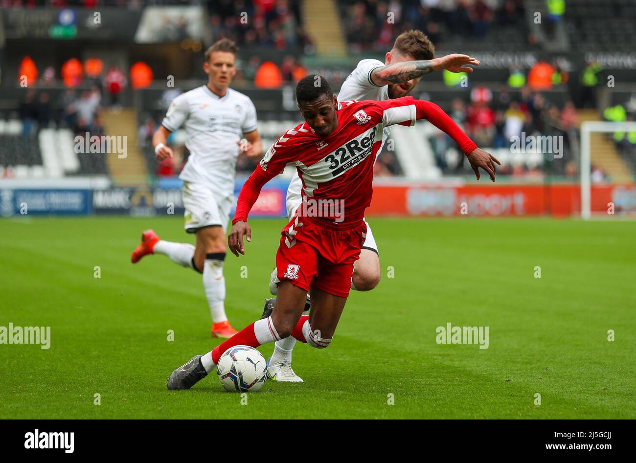 23rd April 2022,  Swansea.com stadium, Swansea, Wales; Championship football, Swansea versus Middlesbrough; Isaiah Jones of Middlesbrough and Ryan Manning of Swansea City jostle for possession Stock Photo