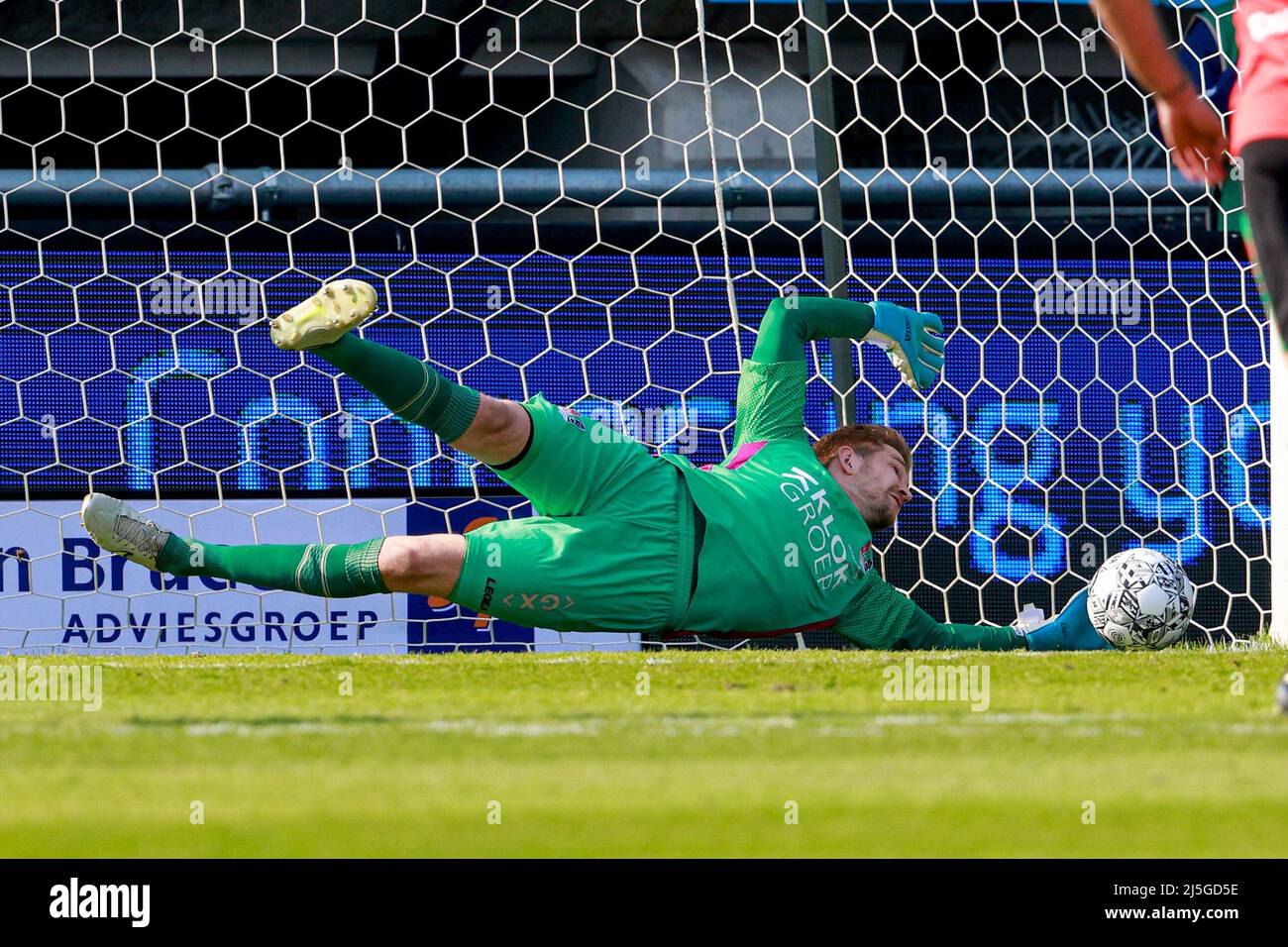 NIJMEGEN, NETHERLANDS - APRIL 23: Goalkeeper Mattijs Branderhorst of N.E.C.  deflecting penalty ball of Dusan Tadic (c) of Ajax during the Dutch  Eredivisie match between NEC Nijmegen and Ajax at Het Goffertstadion