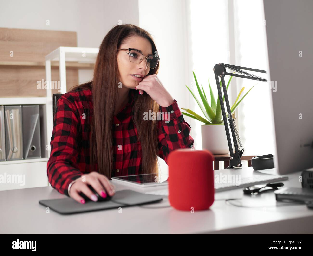 young woman suffer from headaches at office Stock Photo