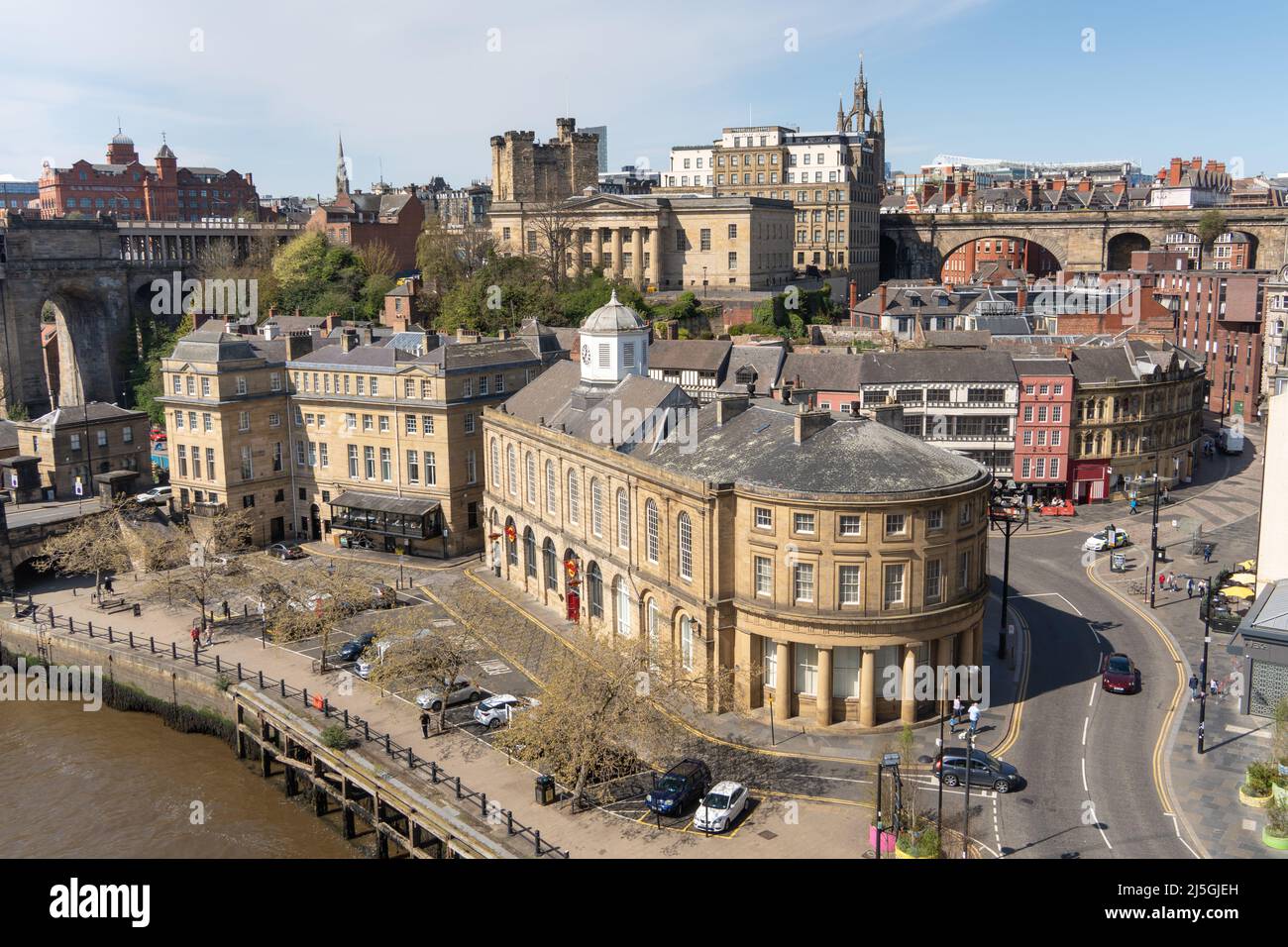 View looking down to the Newcastle upon Tyne, UK Quayside from the Tyne Bridge, including the Guildhall, with a Hard Rock Café. Stock Photo