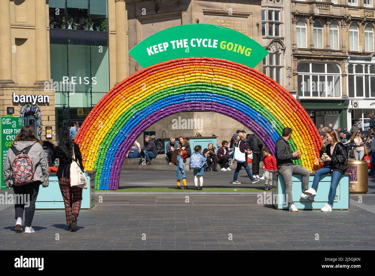 Keep the Cycle Going. A rainbow of aluminum cans gets the attention of