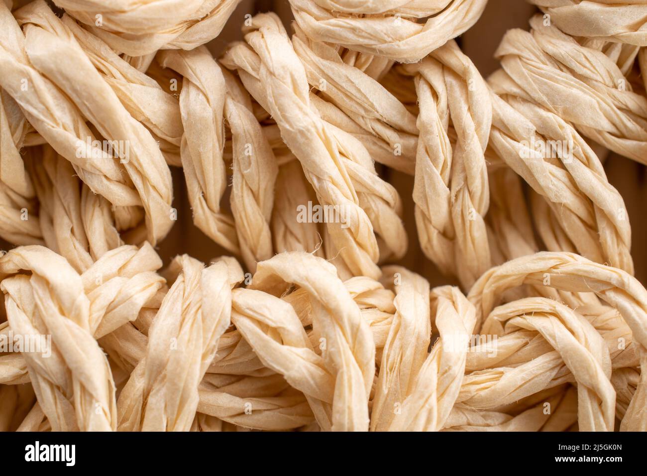 Wicker straw mat, close-up, top view. Stock Photo