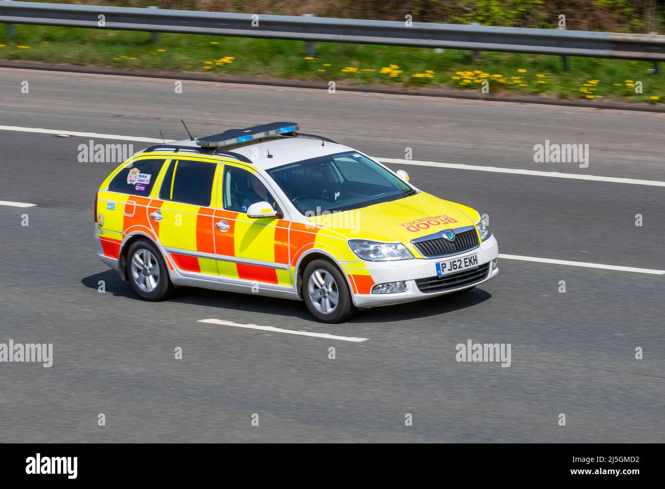 Blood Emergency, Medical supplies transported in 2012 Skoda Octavia 1968cc diesel emergency vehicle driving on the M61 motorway in Manchester, UK Stock Photo