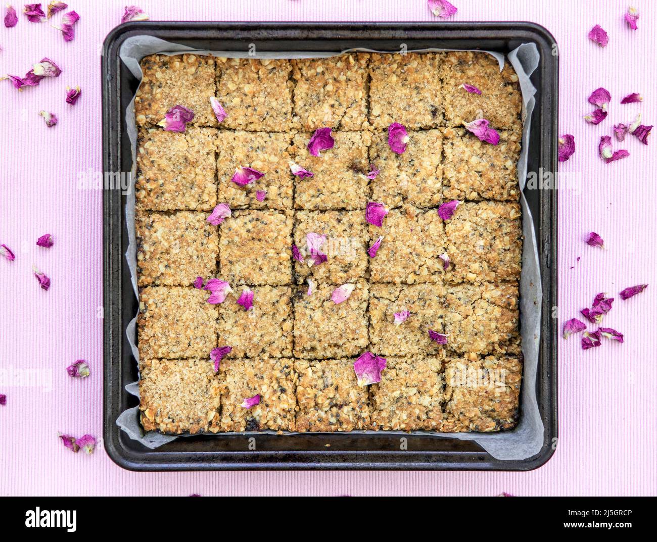 Home made tray bake of Date and Oat slices. Cut into squares Stock Photo