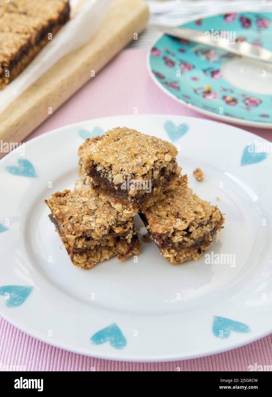Home made tray bake of Date and Oat slices. Cut into squares Stock Photo