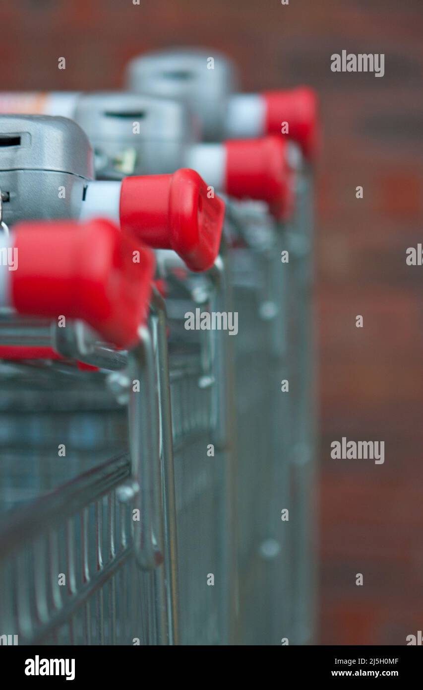 Shopping trolleys stacked up together hires stock photography and