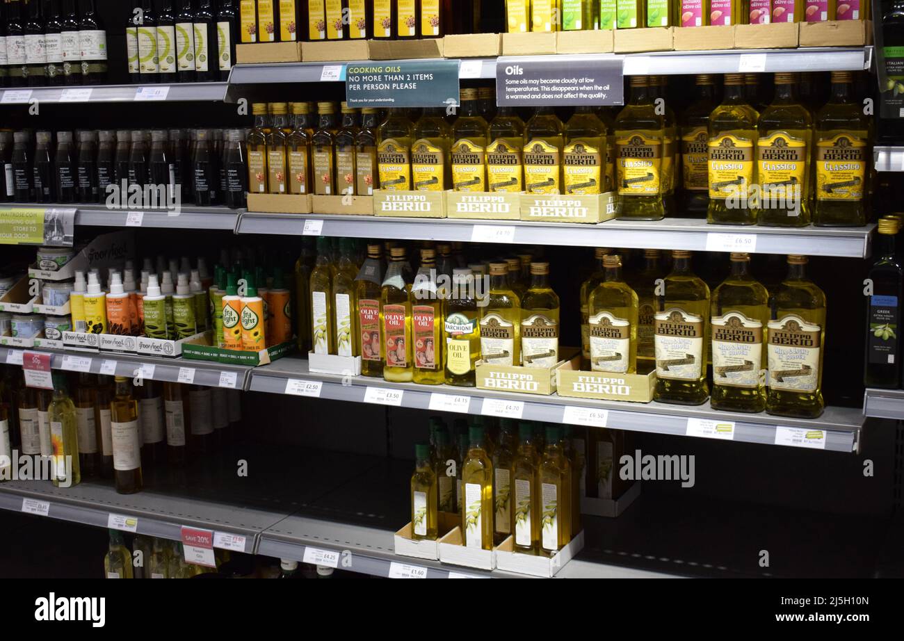 A sign in the cooking oil section in a supermarket in the Uk stating that customers can only buy 2 items per customer due to sunflower oil shortages Stock Photo