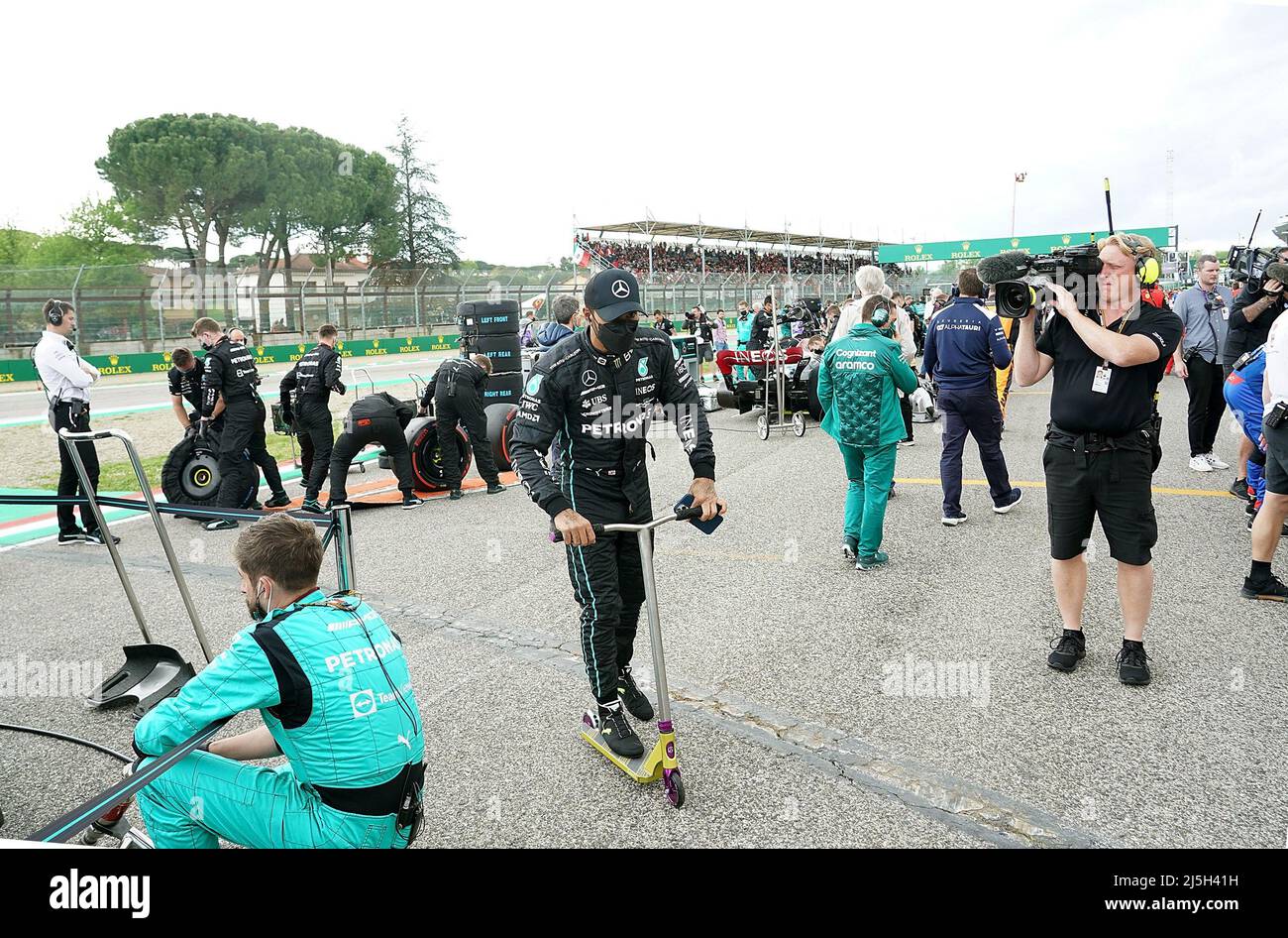 Imola, Italy. 23rd Apr, 2022. Motorsport, Formula 1 World Championship, Grand Prix of Emilia-Romagna, sprint race. Lewis Hamilton from Great Britain of the Mercedes team drives a scooter on the starting grid. Credit: Hasan Bratic/dpa/Alamy Live News Stock Photo