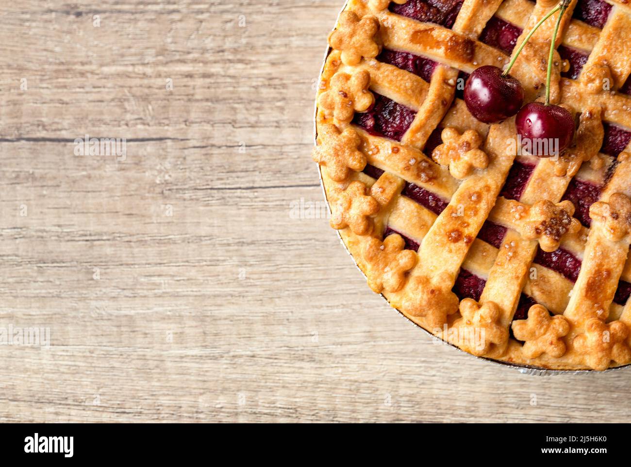 baked cherry pie and fresh cherry top view -copy space Stock Photo