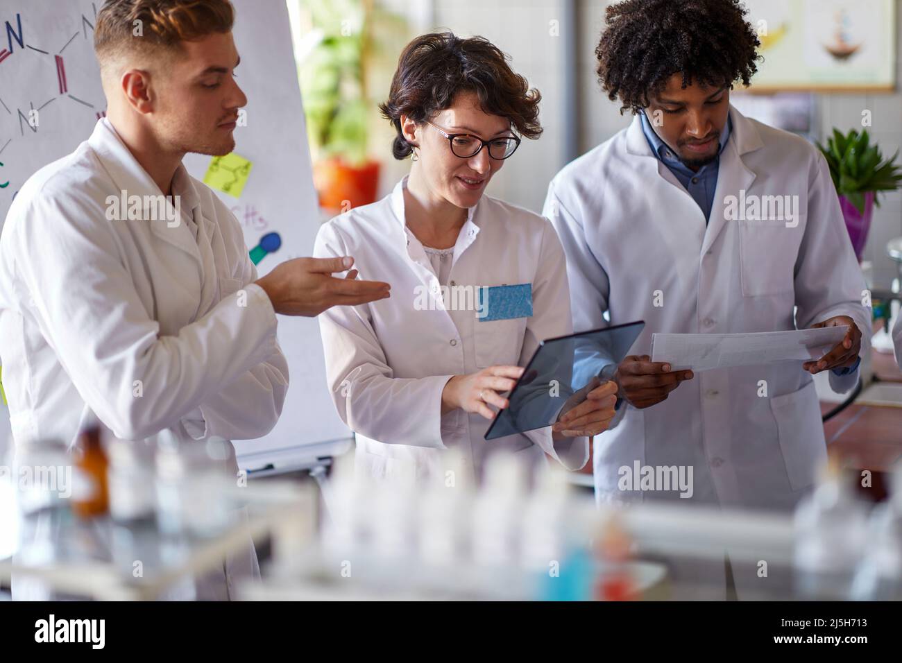 Young medical workers working together in lab Stock Photo