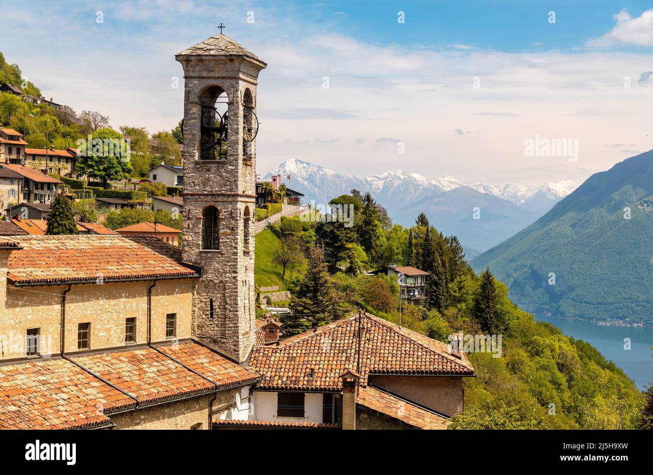 Bell tower of the parish church of Saints Simone and Fedele, located in Brè-Aldesago on the Monte Bre of Lugano,Ticino, Switzerland Stock Photo