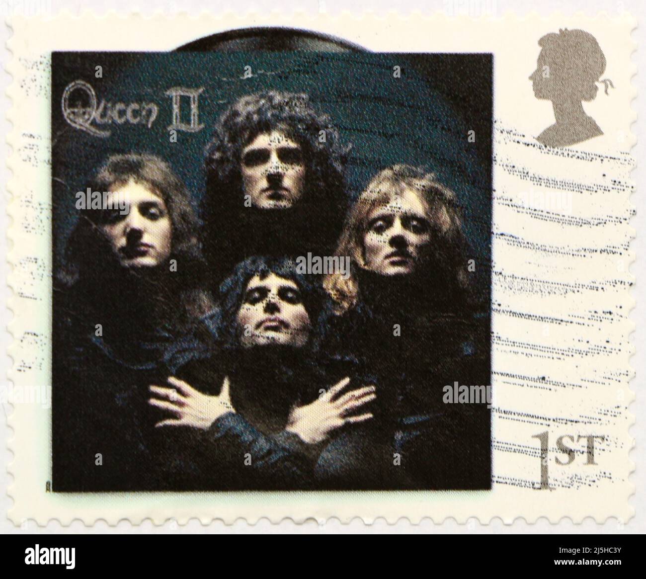 Photo of a British postage stamp with the cover of the album Queen II commemorating the rock band 2020 Stock Photo