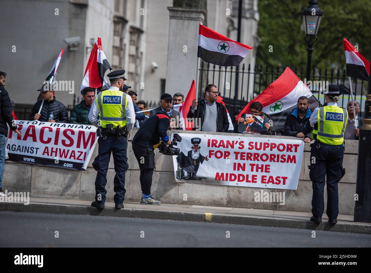 London, UK. 23rd Apr, 2022. Police officers stand on guard during the Iran protest at Whitehall. There's a water shortage/crisis in Khuzestan, but the government of Iran is focused on crushing protestors who rally for this issue rather than dealing with the water crisis. Credit: SOPA Images Limited/Alamy Live News Stock Photo