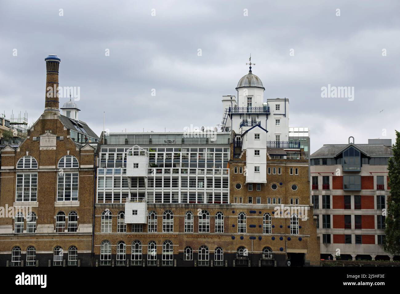 Luxury riverside apartments at Butlers Wharf on the south bank of the River Thames in London Stock Photo