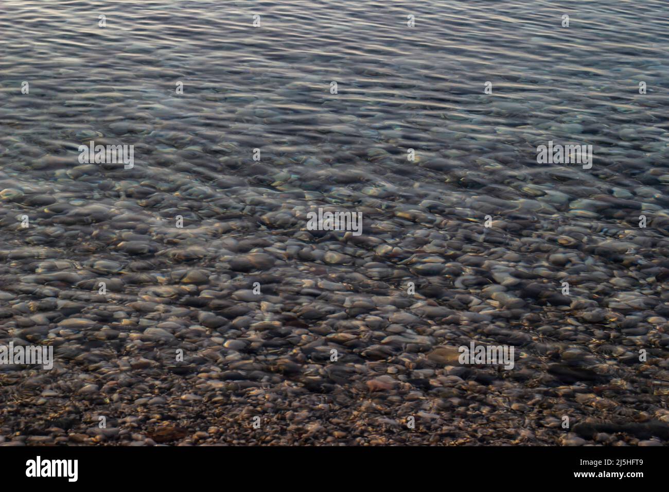 Sea ripple or shiny pebble reflection at Antalya beach, Turkey Stock ...