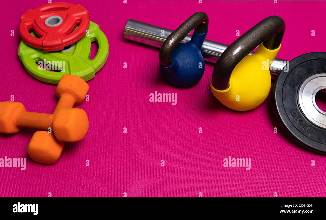 Weight dumbbells sport red rod yellow blue green steel, concept healthy lifestyle training lifestyle for healthy from shiny template, trainer beauty Stock Photo