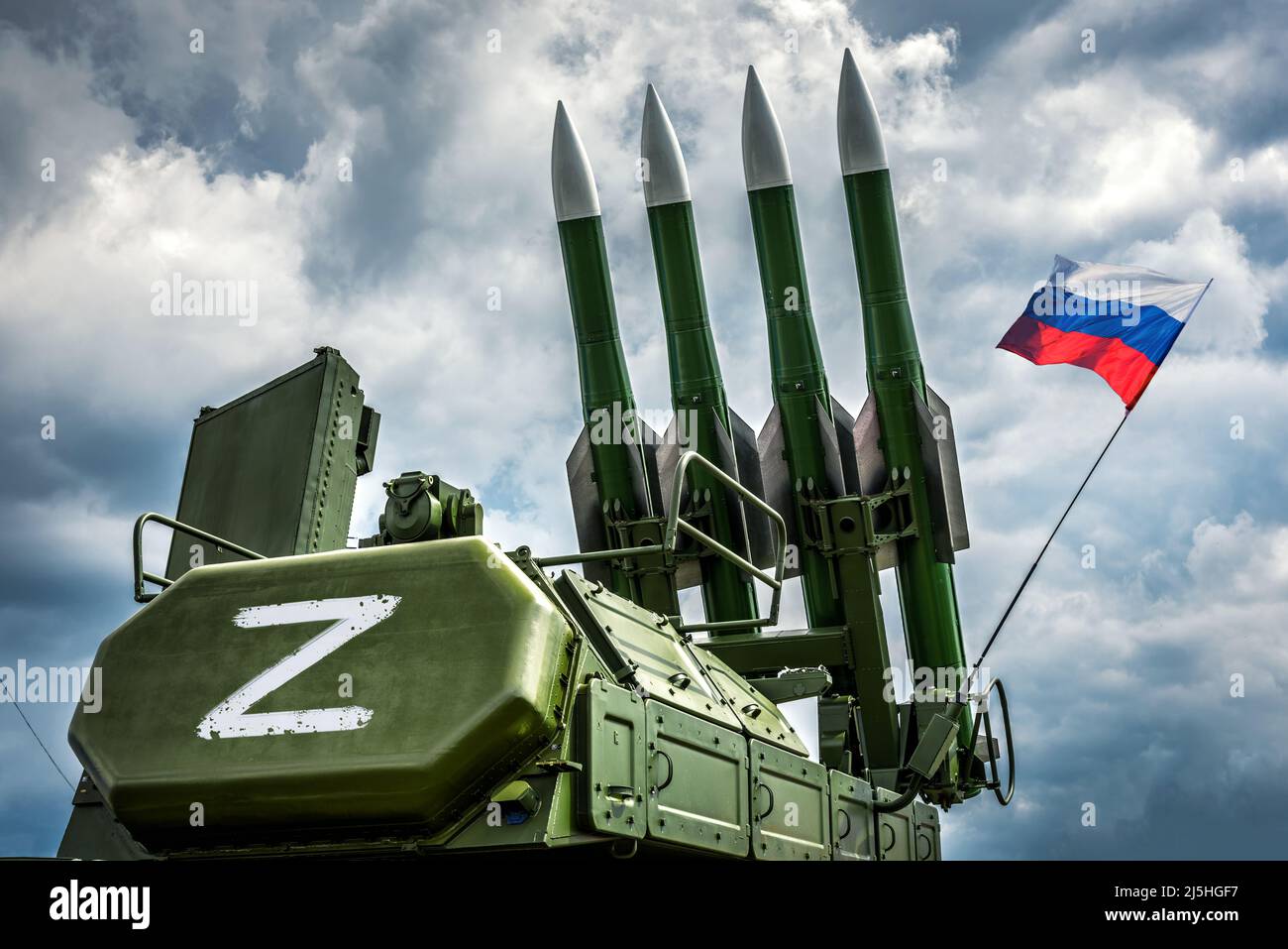 Russian missile system Buk-M2 with Z sign and flag, modern rocket weapons of forces of Russia, military equipment in combat readiness. Z-troops of Rus Stock Photo
