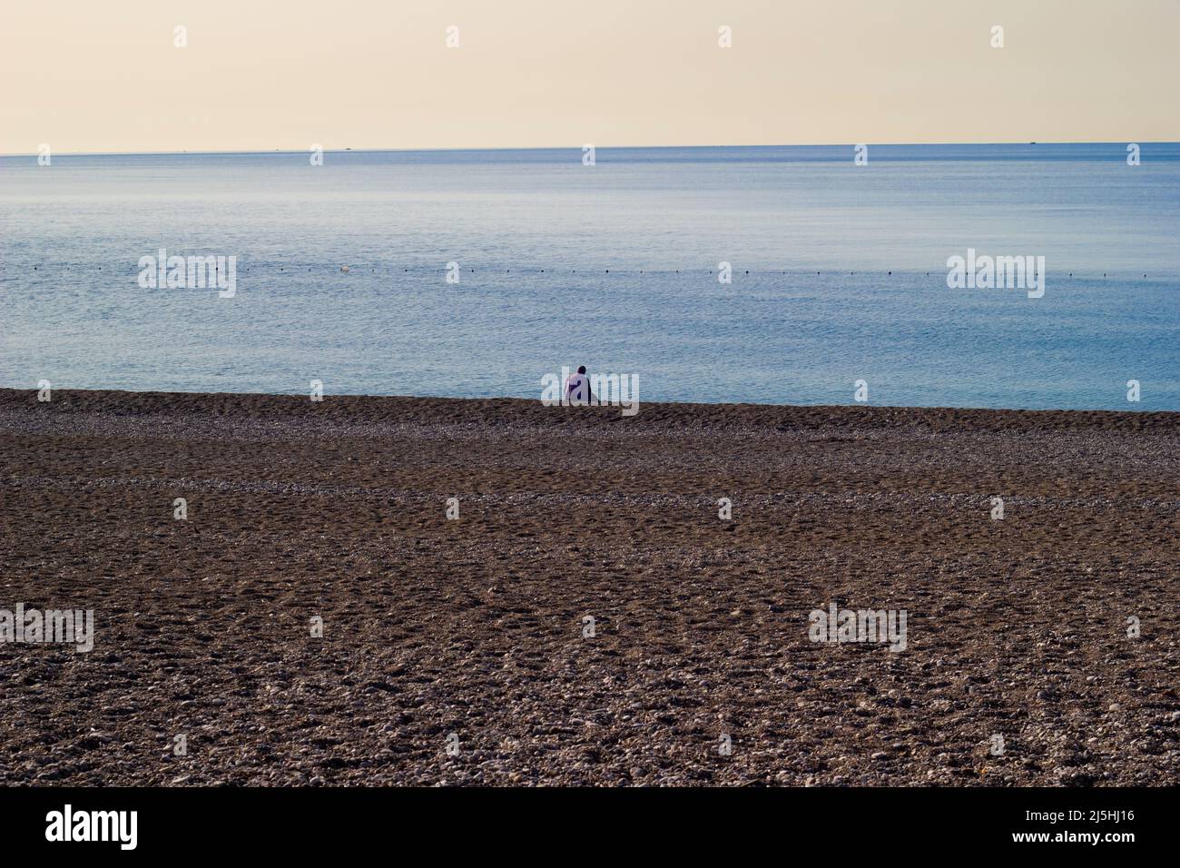 Lonely man watches beautiful hi-res stock photography and images - Alamy