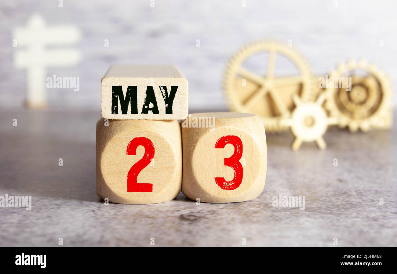 Calendar for May 23: cube with the number 23, the name of the month of May