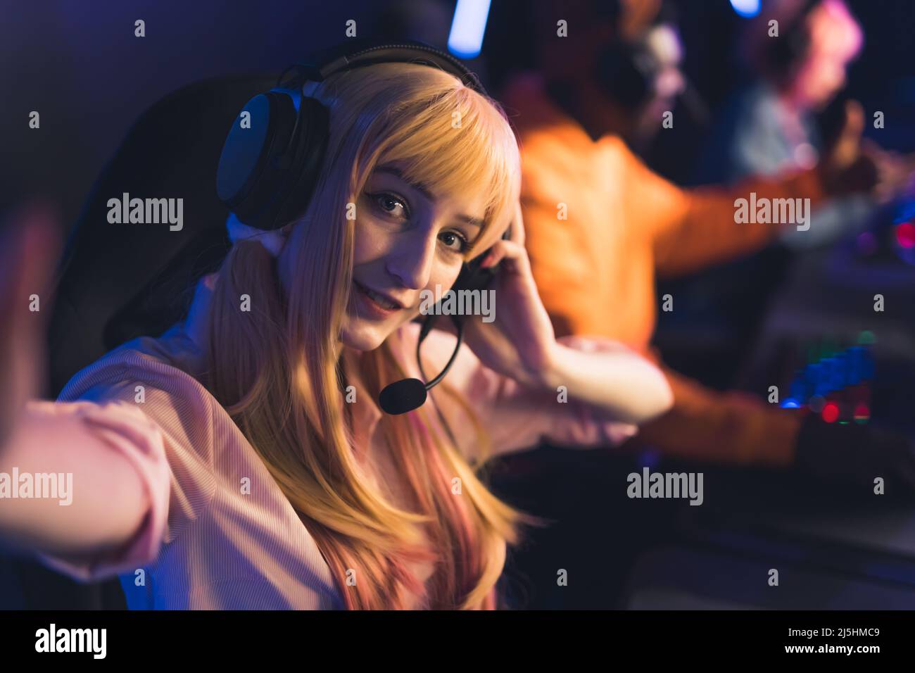 Portrait of seductive excited caucasian blonde girl taking selfie photo  while playing video game in PC bang, Internet cafe. High quality photo  Stock Photo - Alamy