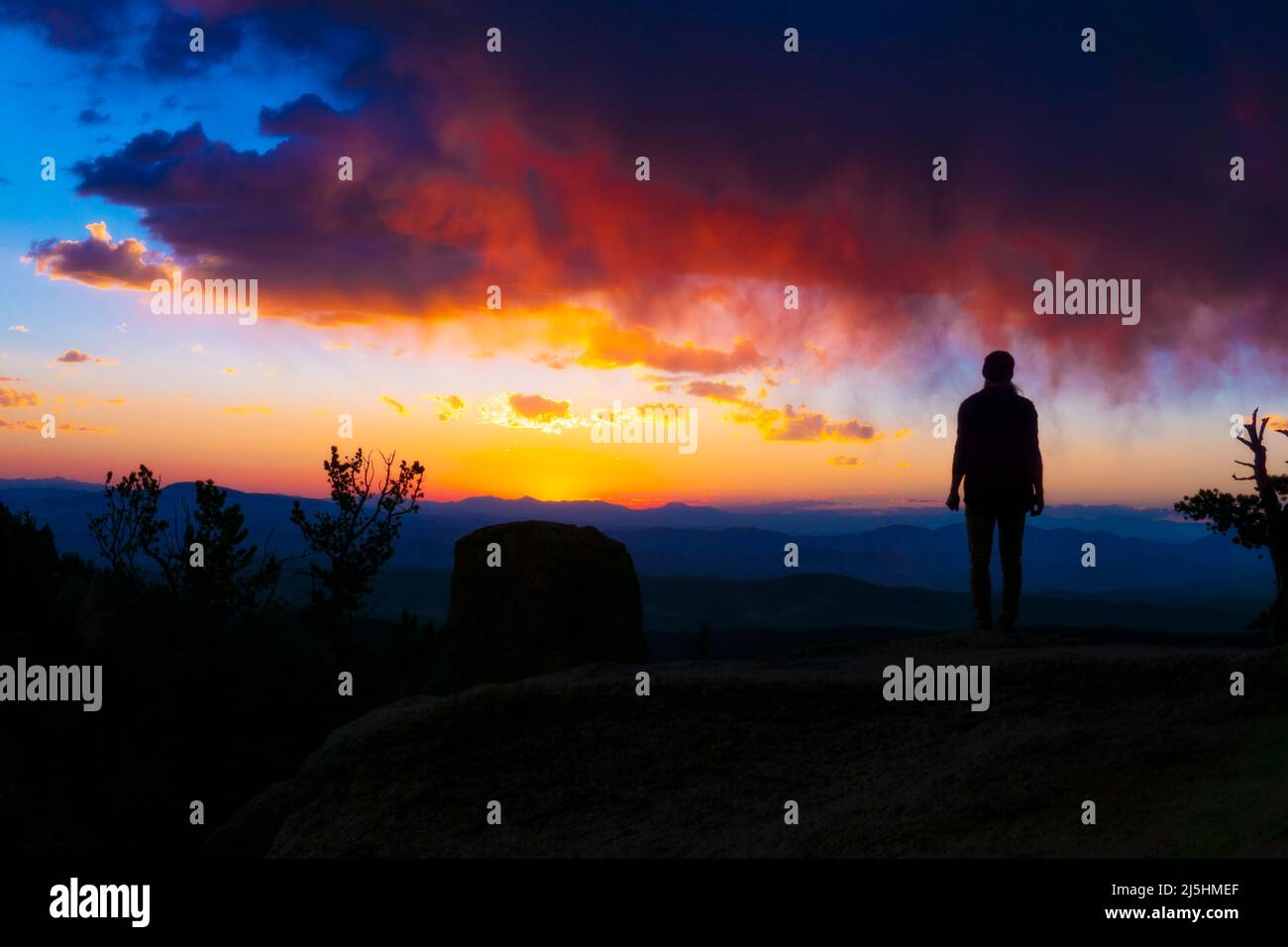 Beautiful Serene Calm Person At Colorful Sunset From Landscape View Stock Photo